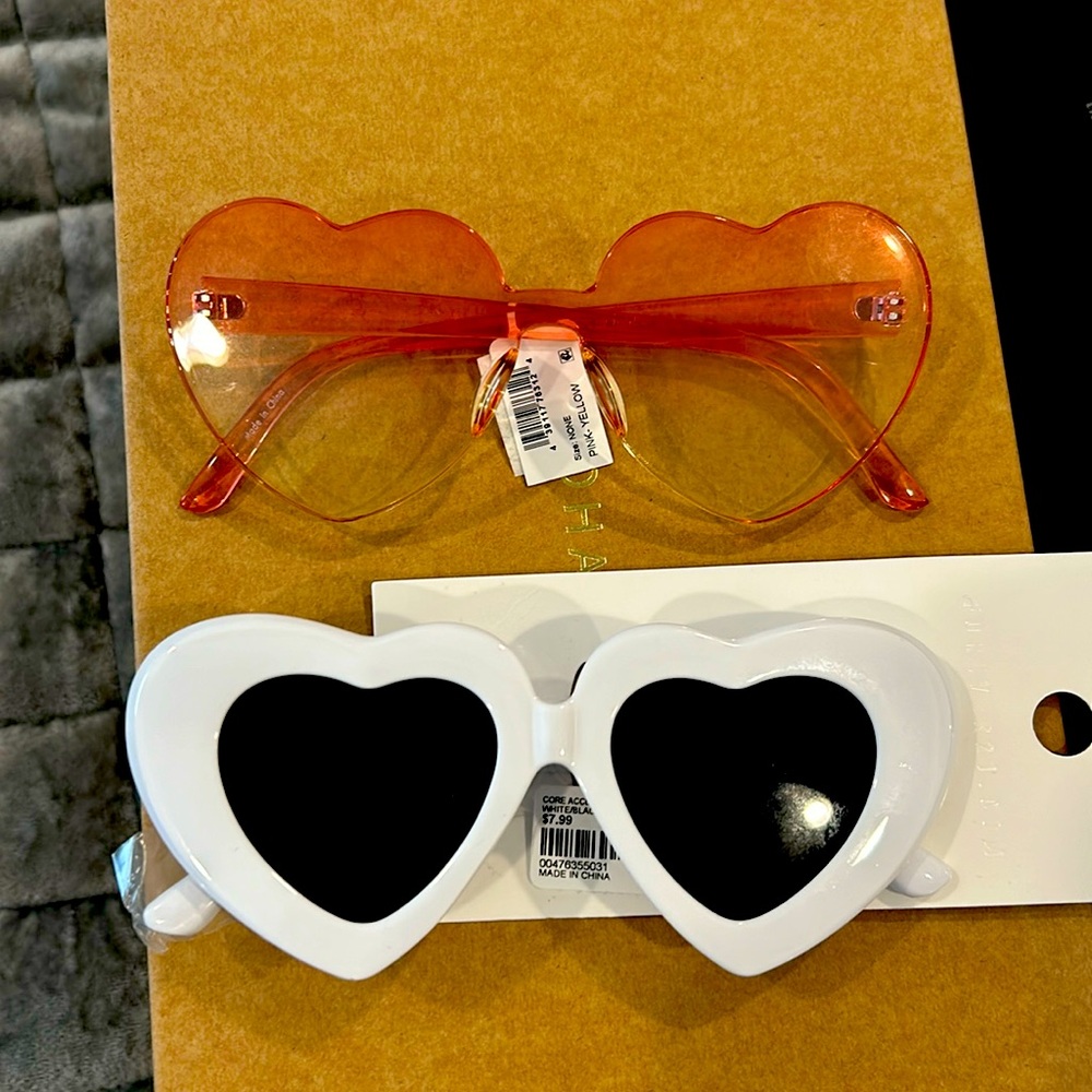 Two pair of heart shape sunglasses sold together
